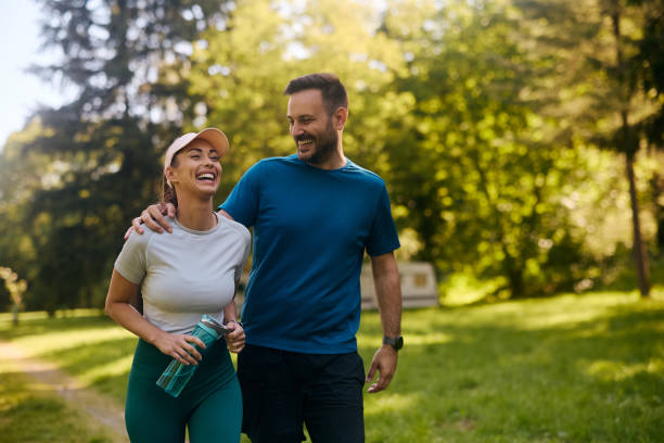 Couple enjoying a walk outdoors in a green park